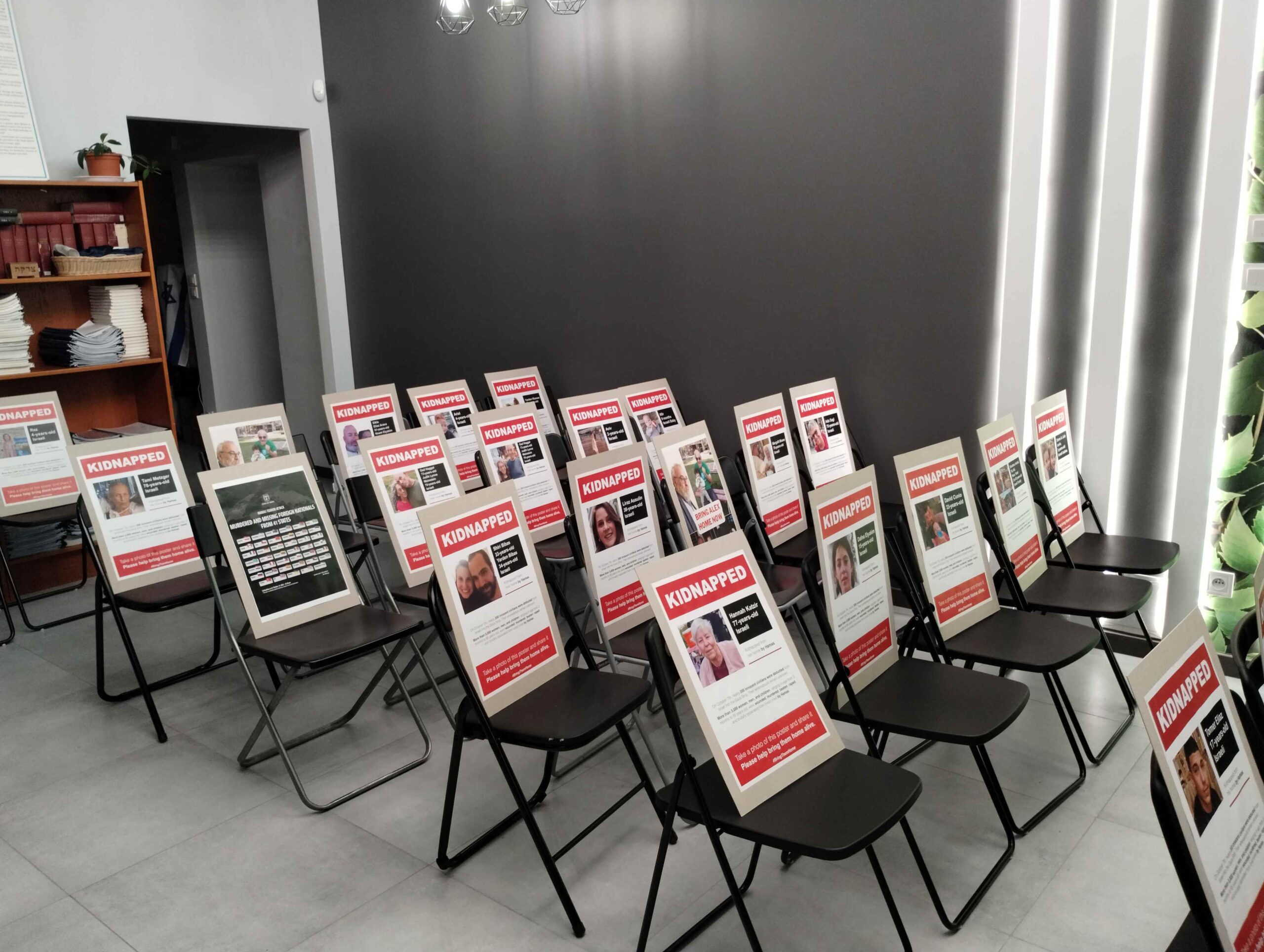Beit Polska filled synagogue seats with posters for kidnapped Israeli individuals 1
